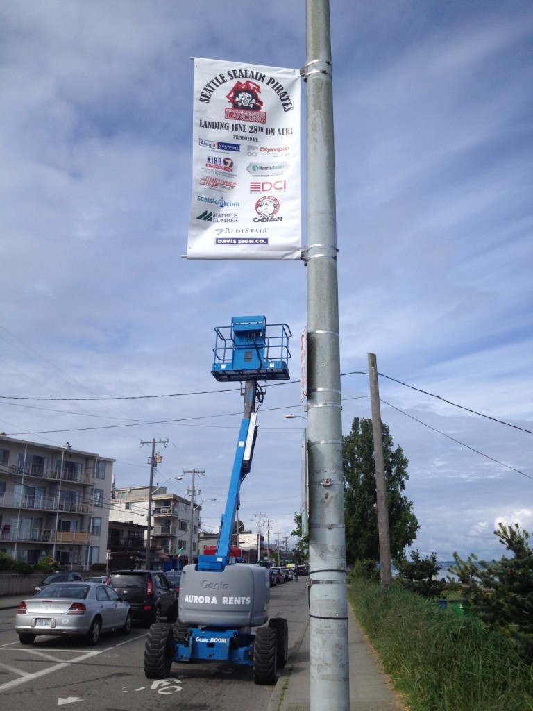 Signs of summer: Banners go up for Seafair Pirates Landing on Alki